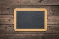 Blank small chalkboard on an old rustic background, close up