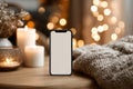 Blank Smartphone Screen in Festive, Cozy Indoor Setting Royalty Free Stock Photo