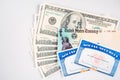 Blank social security card, united states treasury stimulus check and dollar bills Royalty Free Stock Photo