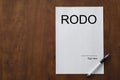 Blank space on wooden desk with RODO document.