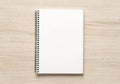 Blank spiral bound notepad mockup template on wood background Royalty Free Stock Photo