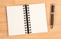 Blank Spiral Note Pad and Pen on Wood Royalty Free Stock Photo
