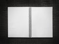 Blank spiral notebook on a black leather background Royalty Free Stock Photo