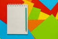 Blank spiral notepad on the colored embossed paper sheets Royalty Free Stock Photo