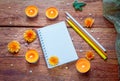 Blank spiral notepad, colorful pencils and burning aroma candles