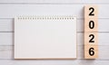 Blank Spiral Notepad with 2026 Wooden Blocks on White Wooden Background for Planning Concepts Royalty Free Stock Photo