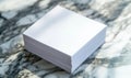 Blank stack of white paper on marble surface for creative projects and note-taking Royalty Free Stock Photo