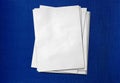Blank Stack of A4 White Printer Paper Sheets placed on blue fabric wallpaper background Empty Clean Office Documentation Mockup Royalty Free Stock Photo