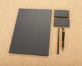 Blank Stationery on cork board. Consist of Business cards, A4 letterheads, pen and pencil. Royalty Free Stock Photo