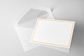 Blank stationery: greeting card with gold frame and envelope Royalty Free Stock Photo