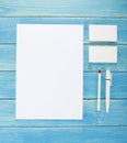 Blank Stationery on wooden background. Consist of Business cards, A4 letterheads, pen and pencil. Royalty Free Stock Photo