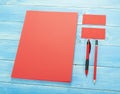 Blank Stationery on wooden background. Consist of Business cards, A4 letterheads, pen and pencil