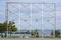 Blank steel billboard structure for outdoor advertising poster or advertisement in front of a seascape