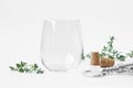 Blank stemless wine glass mockup in white background. Royalty Free Stock Photo