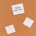 Blank stickers are nailed on the board and with the inscription Happy Labor Day Royalty Free Stock Photo