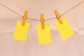 Blank sticky notes hanging with cloth pins on clothes line Royalty Free Stock Photo