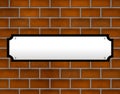 Blank street sign on brick wall