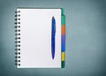 Blank student notebook and pen, top view