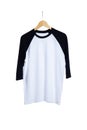 Blank t shirt raglan 3/4 sleeves front view with black and white color on wood hanger isolated on white background, ready for Royalty Free Stock Photo