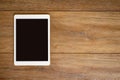 Blank Tablet computer on wood table background with space for te Royalty Free Stock Photo