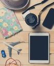 Blank tablet screen with travel objects Royalty Free Stock Photo