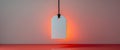 Blank Tag on a String with Orange Lighting and Reflection, Ready for your Message. Royalty Free Stock Photo