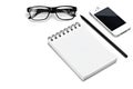 Blank template spiral white notebook notepad, glasses, pencil, smartphone isolated white background