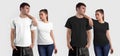 Blank textural t-shirt template, white, black clothes on a guy, a girl, isolated on the background.  Set Royalty Free Stock Photo