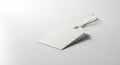A blank, textured, white paper tag with a string loop is resting Royalty Free Stock Photo