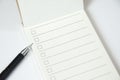 Blank to do list planner with checklist and black pen on white background, close up Royalty Free Stock Photo