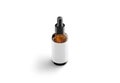 Blank transparent amber glass dropper bottle with white label mockup Royalty Free Stock Photo