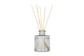 Aromatic reed diffuser in a glass vase isolated on white background