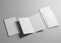 Blank tri fold brochure mockup with soft shadows on a neutral surface Royalty Free Stock Photo