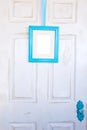 Blank Turquoise Picture Frame on Distressed Door