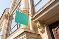 Blank turquoise sign on the building. advertising and signs on city streets.