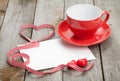 Blank valentines greeting card and red coffee cup