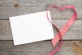 Blank valentines greeting card and red heart shaped ribbon Royalty Free Stock Photo