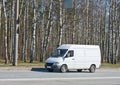 Blank van drives by Royalty Free Stock Photo