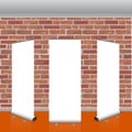Blank vector roll up banners display mockup. Red brick wall. Royalty Free Stock Photo