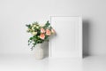 Blank vertical artwork frame mockup with roses flowers bouquet