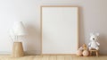Blank vertical frame on monochrome soft background in children's room. Mock up for a photo or illustration Royalty Free Stock Photo