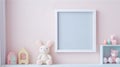 Blank vertical frame on monochrome soft background in children's room. Mock up for a photo or illustration Royalty Free Stock Photo