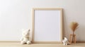 Blank vertical frame on monochrome soft background in children's room. Mock up for a photo or illustration Royalty Free Stock Photo