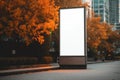 Blank vertical outdoor billboard mockup on city street on bright vibrant autumn day Royalty Free Stock Photo