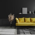 Blank vertical poster frame mock up on shelf in dark modern interior background, Living room interior with black wall and yellow Royalty Free Stock Photo