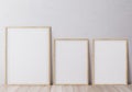 Blank vertical poster frame mock up standing on wooden floor. Royalty Free Stock Photo
