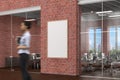 Blank vertical poster mock up on the red brick wall in office interior Royalty Free Stock Photo