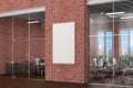 Blank vertical poster mock up on the red brick wall in office interior Royalty Free Stock Photo