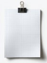 A blank, vertically oriented stack of gridded, square-ruled graph paper, secured at the top center with a black metal binder clip Royalty Free Stock Photo