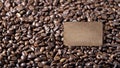 Blank vintage cardboard tag on dark brown background of coffee beans Royalty Free Stock Photo